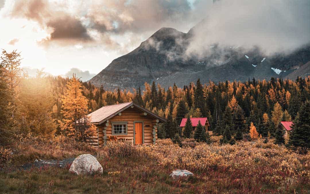 rv campgrounds wooden huts with sunshine in autumn forest